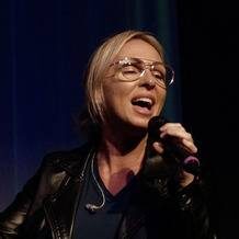Vocalist in leather jacket singing